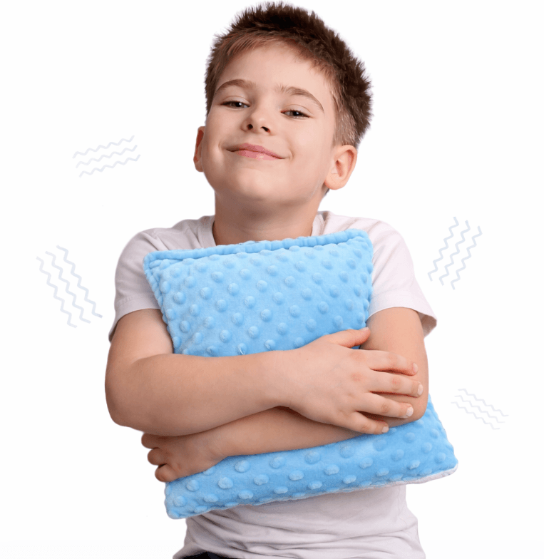 Niño con cojín sensorial vibratorio El Búho Azul
