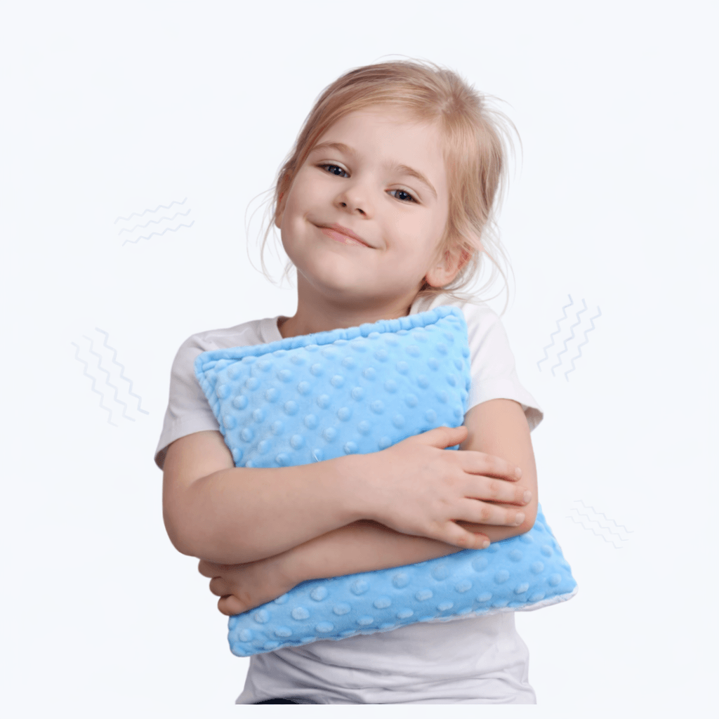 Niña con cojín sensorial vibratorio El Búho Azul