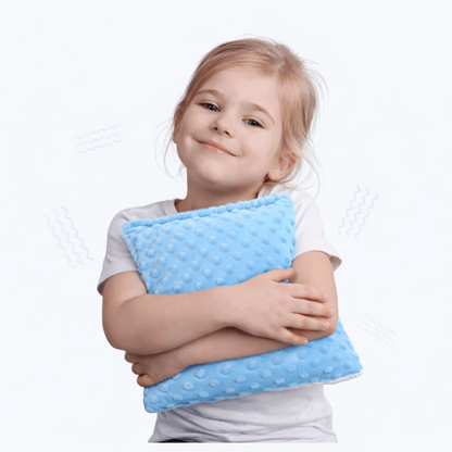 Niña con cojín sensorial vibratorio El Búho Azul