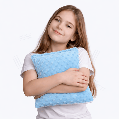 Niña con cojín sensorial vibratorio El Búho Azul